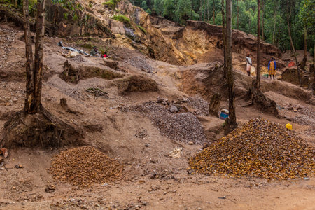 KABALE, UGANDA - MARCH 18, 2020: Local people excavating stone in a quarry near Kabale, Ugandaのeditorial素材