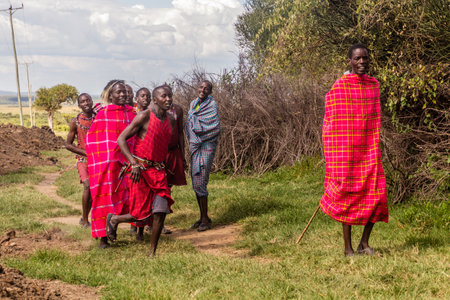 MASAI MARA, KENYA - FEBRUARY 20, 2020: Masai people perform their Jumping Dance, Kenyaのeditorial素材