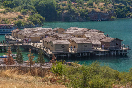 OHRID, NORTH MACEDONIA - AUGUST 8, 2019: Bay of Bones, prehistoric pile-dwelling, recreation of a bronze age settlement on Lake Ohrid, North Macedoniaのeditorial素材