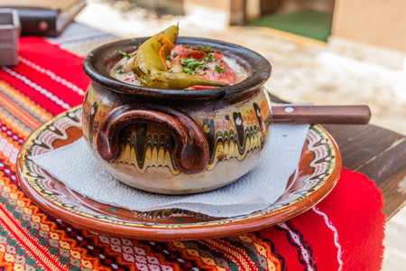Typical dish of Bulgaria - Gyuveche. Meal baked in a clay pot.の写真素材