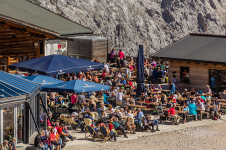 ZUGSPITZE, GERMANY - SEPTEMBER 4, 2019: Tourists at Zugspitzplatt plateau under Zugspitze peak, Germanyのeditorial素材
