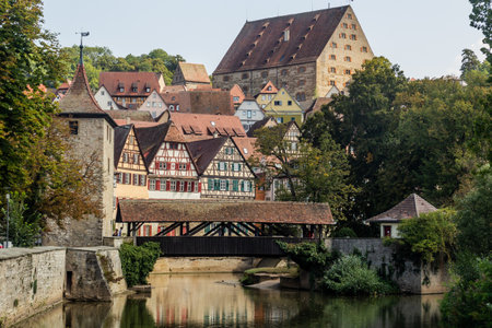 Old houses reflecting in Kocher river in Schwabisch Hall, Germanyの写真素材