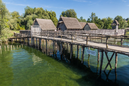 UNTERUHLDINGEN, GERMANY - SEPTMBER 3, 2019: Stilt houses (Pfahlbauten), Stone and Bronze age dwellings in Unteruhldingen town, Baden-Wurttemberg state, Germanyの写真素材