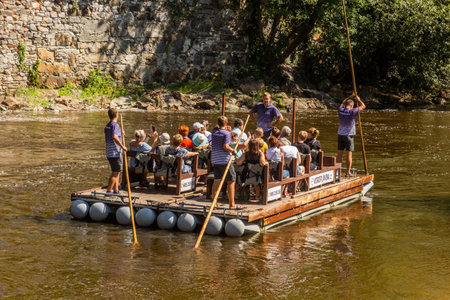 CESKY KRUMLOV, CZECHIA - AUGUST 6, 2020: Raft on Vltava river in Cesky Krumlov, Czech Republicのeditorial素材