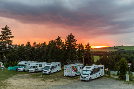 NIZKE TATRY, SLOVAKIA - AUGUST 13, 2020: Sunset in Bystrina camping site in Nizke Tatry mountains, Slovakiaのeditorial素材