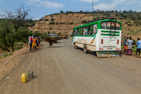 OMO VALLEY, ETHIOPIA - FEBRUARY 2, 2020: Bus waiting on a road block in Omo Valley, Ethiopiaのeditorial素材