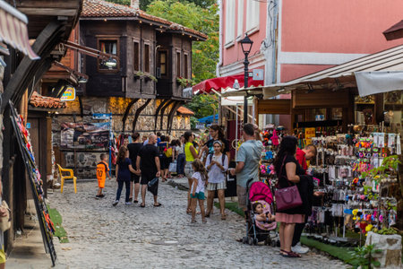 SOZOPOL, BULGARIA - JULY 23, 2019: Tourists on a cobbled street in Sozopol, Bulgaria