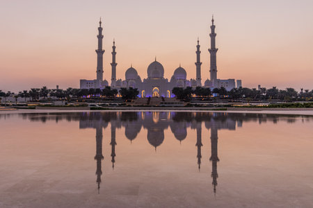 Evening view of Sheikh Zayed Grand Mosque in Abu Dhabi reflecting in a water, United Arab Emirates.の写真素材