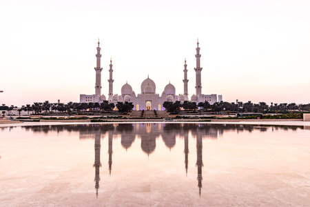 Evening view of Sheikh Zayed Grand Mosque in Abu Dhabi reflecting in a water, United Arab Emirates.の写真素材