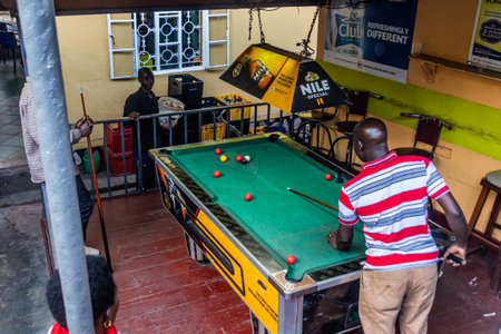 KABALE, UGANDA - MARCH 19, 2020: Pool game in a local pub in Kabale, Ugandaのeditorial素材