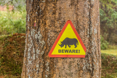 Beware sign in Ziwa Rhino Sanctuary, Ugandaの写真素材
