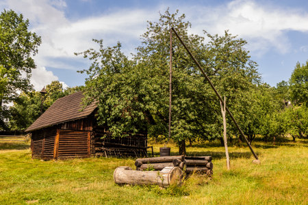 Wooden well in the open air museum (Valasske muzeum v prirode) in Roznov pod Radhostem, Czechiaの写真素材
