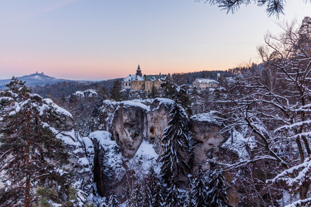 Evening winter view of Trosky castle and Hruba Skala chateau, Czech Republicの写真素材