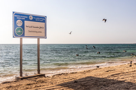 FARASAN, SAUDI ARABIA - NOVEMBER 22, 2021: Swimming area sign on Janaba beach on Farasan island, Saudi Arabiaのeditorial素材