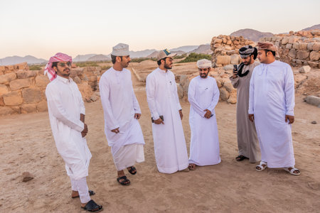 NAJRAN, SAUDI ARABIA - NOVEMBER 26, 2021: Tourists visiting ruins of Al-Ukhdud in Najran, Saudi...