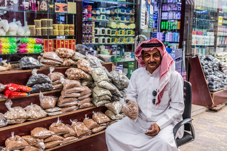 NAJRAN, SAUDI ARABIA - NOVEMBER 27, 2021: Seller on a market in Najran, Saudi Arabia