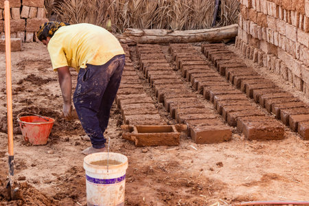 AL ULA, SAUDI ARABIA - NOVEMBER 8, 2021: Adobe brock making in Al Ula Old town, Saudi Arabia