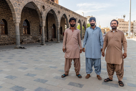 MEDINA, SAUDI ARABIA - NOVEMBER 12, 2021: Pakistani workers renovating the former train station of Hejaz railway in Medina, Saudi Arabiaのeditorial素材