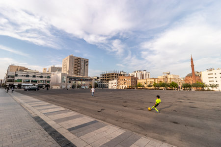 MEDINA, SAUDI ARABIA - NOVEMBER 12, 2021: Playing football at empty grounds near Qiba road in...