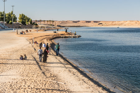 DUMAT AL JANDAL, SAUDI ARABIA - NOVEMBER 5, 2021: People enjoy Dumat al Jandal lake, Saudi Arabiaのeditorial素材