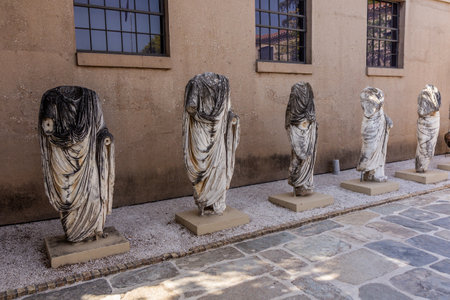 ANCIENT CORINTH, GREECE - AUGUST 5, 2021: Sculptures in the Archaeological Museum of Ancient Corinth, Greeceのeditorial素材