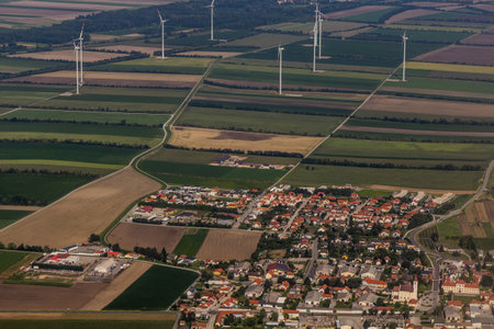 Aerial view of Sommerein village and wind power plants, Austria