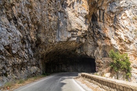 Rock tunnel on Road 82 in Taygetus mountains on Peloponnese peninsula, Greeceの写真素材