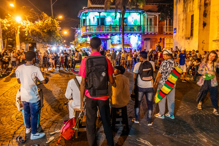 CARTAGENA, COLOMBIA - MARCH 5, 2023: People watch a street artist show on Trinidad square in Getsemani neighborhood of Cartagena de Indias, Colombiaのeditorial素材