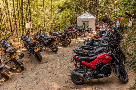 MINCA, COLOMBIA - FEBRUARY 26, 2023: Motorbikes parked at Pozo Azul waterfalls near Minca, Colombiaのeditorial素材