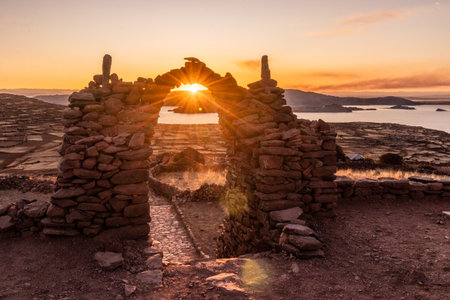 Sunset view of a stone gateway on Pachatata hill on Amantani island in Titicaca lake, Peruの写真素材