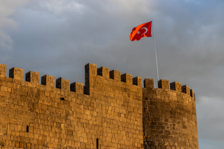 Flag on the Goat Tower of the fortification walls of the old town of Diyarbakir, Turkeyの写真素材