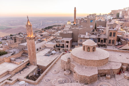 Sunset view of the old town in Mardin with Emir Hamami baths in the foreground, Turkeyの写真素材