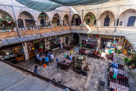 SANLIURFA, TURKEY - SEPTEMBER 22, 2022: Mencek Hani Inn courtyard at the bazaar in Sanliurfa, Turkeyのeditorial素材