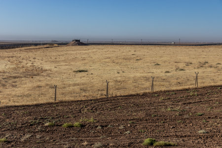 Border wall, pillbox and fence between Turkey and Syriaの写真素材