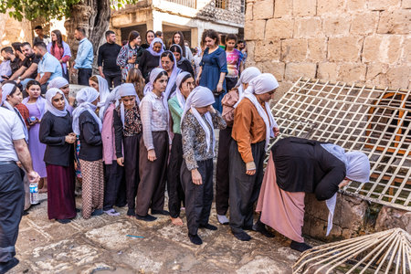 LALISH, IRAQ - SEPTEMBER 30, 2022: Yezidi women during Friday festivities in Lalish temple complex,...