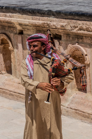 JERASH, JORDAN - JULY 16, 2022:  Musician at the Southern Theatre in Jerash, Jordan