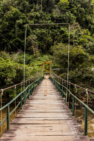 Hanging bridge over Huallaga river near Catarata Gloriapata waterfall in Tingo Maria national park, Peruの写真素材