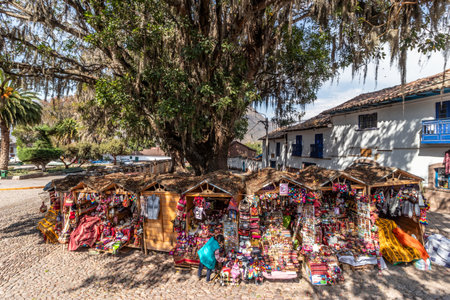 ANDAHUAYLILLAS, PERU - NOVEMBER 7, 2022: Market stalls on a square in Andahuaylillas village, Peruのeditorial素材