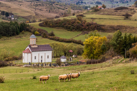 Cemetery and St. George's church in Donje Lopize village near Sjenica, Serbiaの写真素材