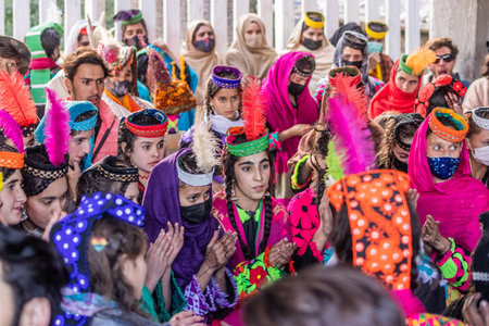 BIRIR, PAKISTAN - OCTOBER 15, 2023: Kalash women wearing traditional costumes during Phool autumn festival in Birir valley, Khyber Pakhtunkhwa, Pakistanのeditorial素材