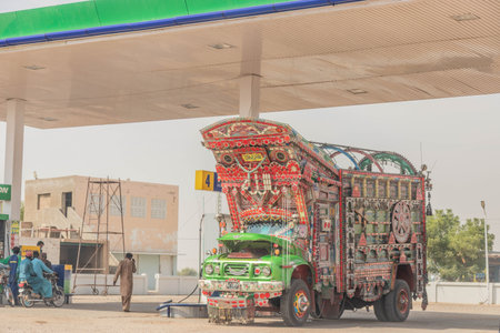 SANN, PAKISTAN - OCTOBER 30, 2023: Colorful truck at a gas station near Sann town, Sindh province, Pakistanのeditorial素材