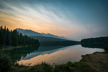 Sunrise and misty morning over Mount Rundle at Two Jack Lake inの写真素材