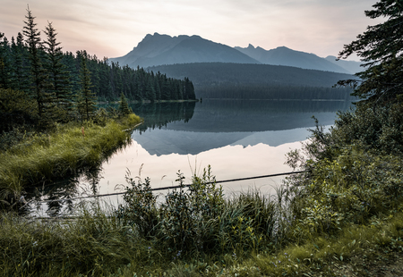Sunrise and misty morning over Mount Rundle at Two Jack Lake inの写真素材