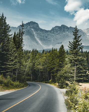 Empty street with mountain panorama in Banff National Park, Canaの写真素材