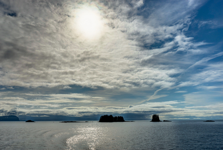 Mountains covered in clouds on a misty morning on the Ferry towaの写真素材