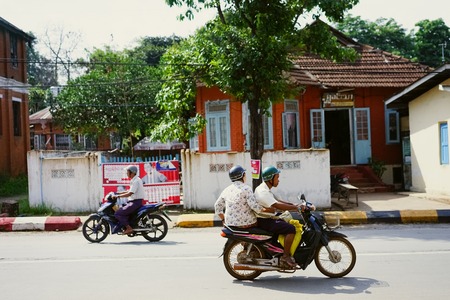 Man driving on motorcycle in Myanmar Burmaのeditorial素材