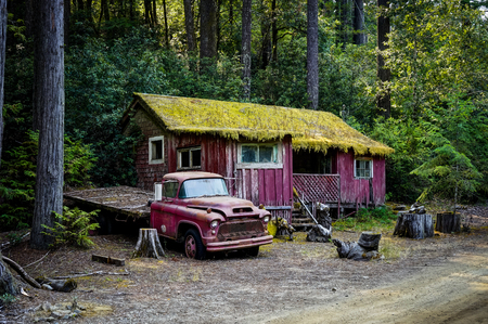 Old car with crumling abandoned old building in California Uniteの写真素材