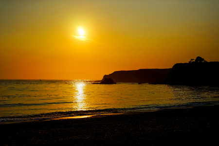 Sunset view with sun towards the beach pacific ocean in Californの写真素材