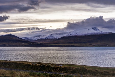 Atlantic Ocean with snow capped mountains and Icelandic Landscapの写真素材
