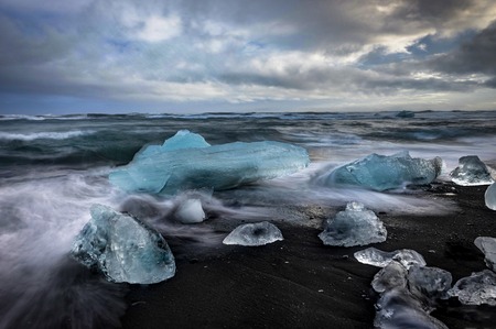Icebergs floating in Jokulsarlon glacier lake at sunset in Icelaの写真素材